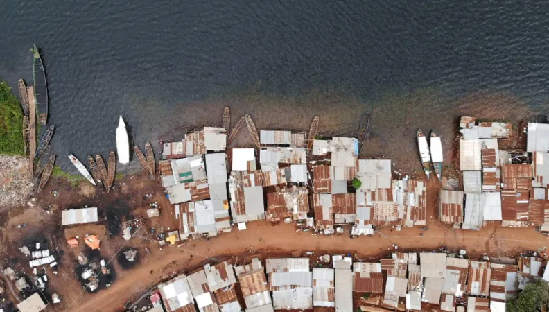 Aerial view of waterfront village in Uganda